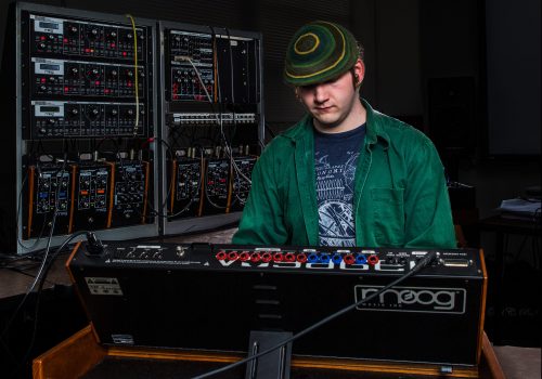 Student mixing music in the Bob Moog studio