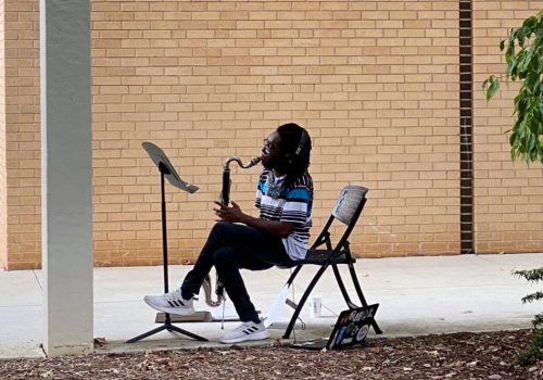 Music student playing a saxophone